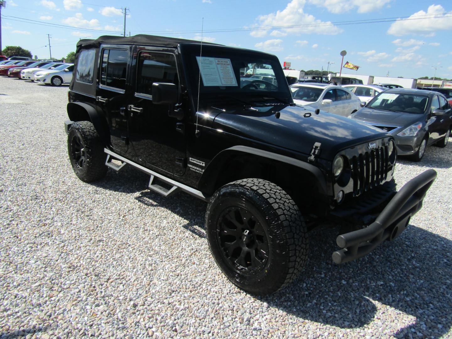 2015 Black /Tan Jeep Wrangler (1C4BJWDG8FL) with an V6 engine, Automatic transmission, located at 15016 S Hwy 231, Midland City, AL, 36350, (334) 983-3001, 31.306210, -85.495277 - Photo#0